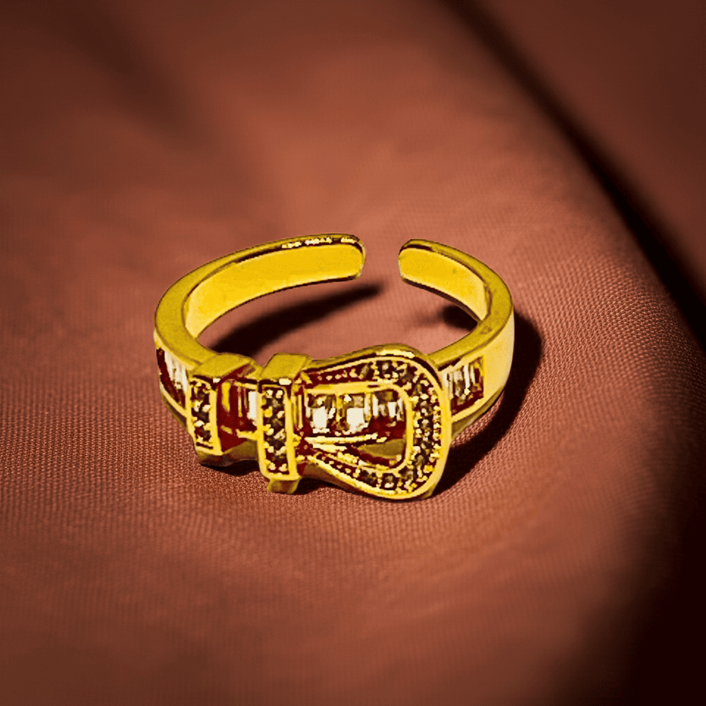 18k Gold ring with a buckle design on a brown textured background