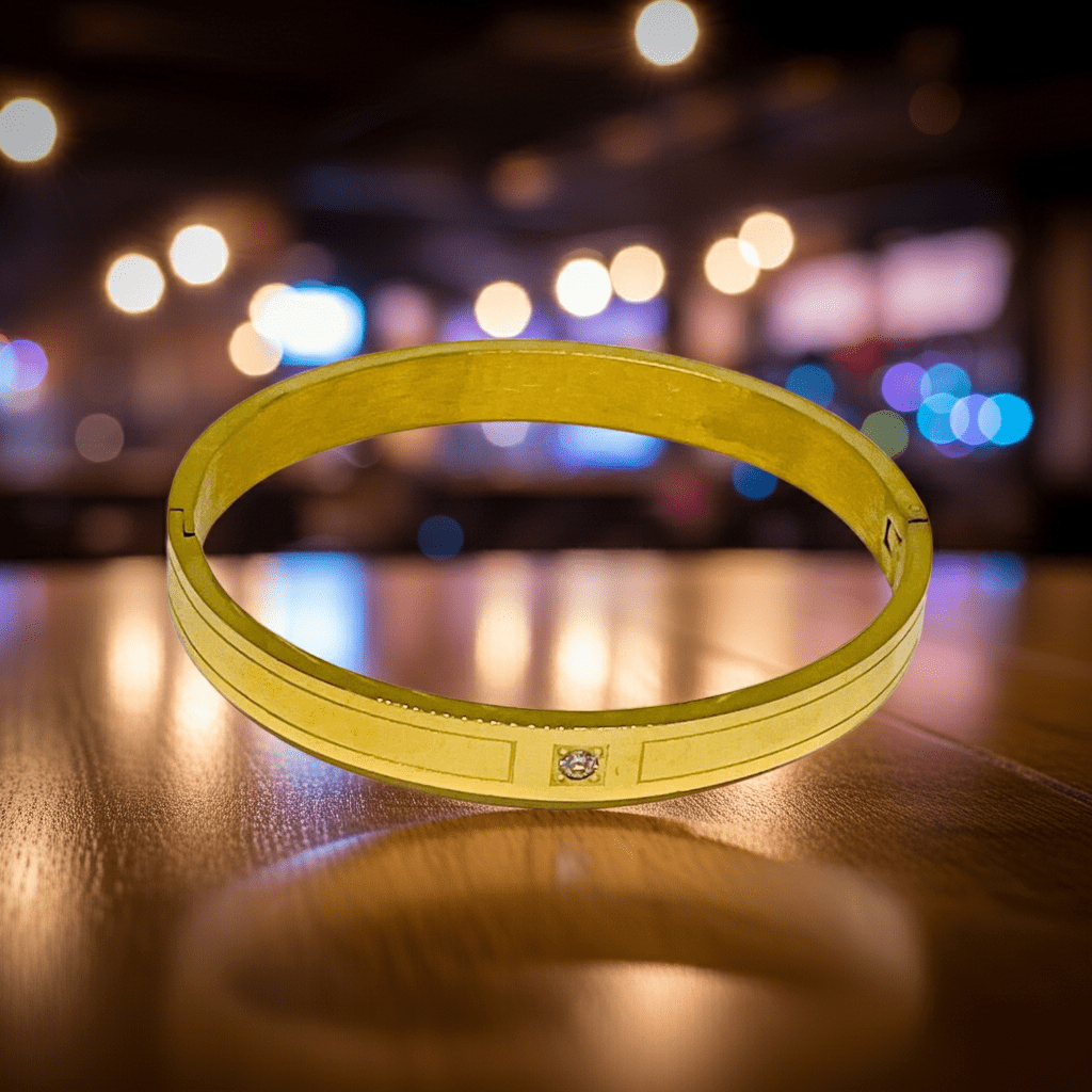 Yellow bracelet on a wooden surface with a blurred background