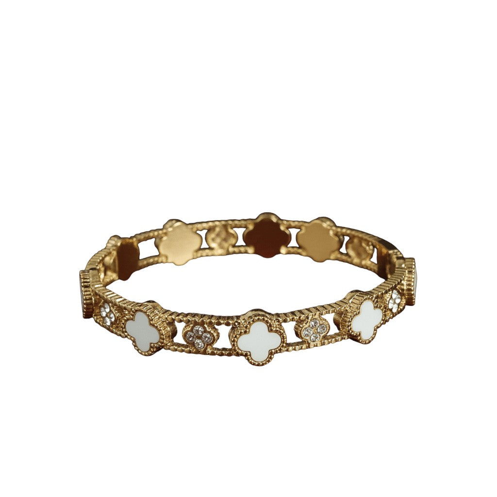 Gold bracelet with floral designs on a white background