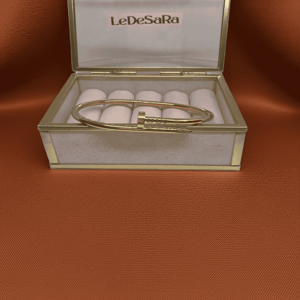 18k Gold Nail design bracelet in a LeDeSaRa box on orange background