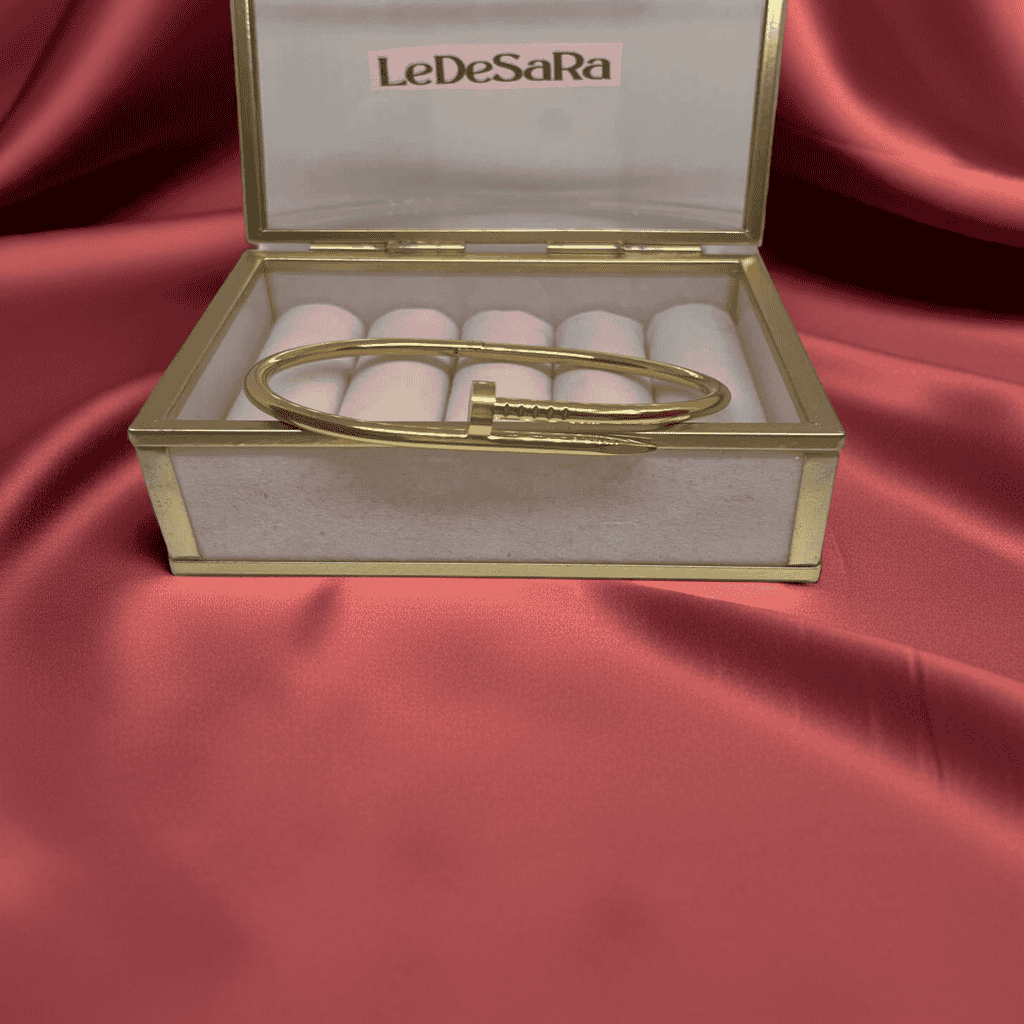 18k Gold Nail design bracelet displayed in a LeDesara box on a red satin background