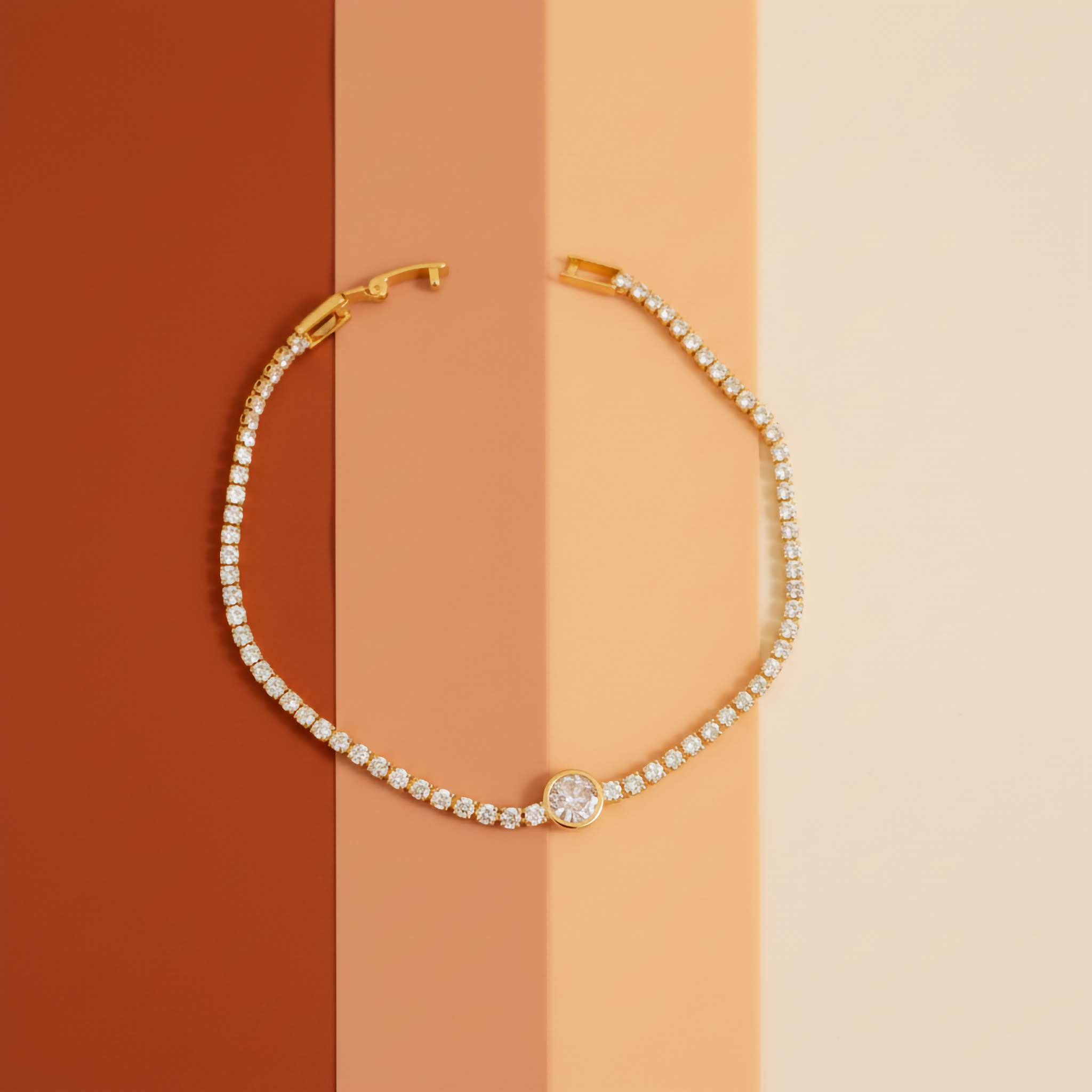 18k Gold plated bracelet with diamond accents on a two-tone background