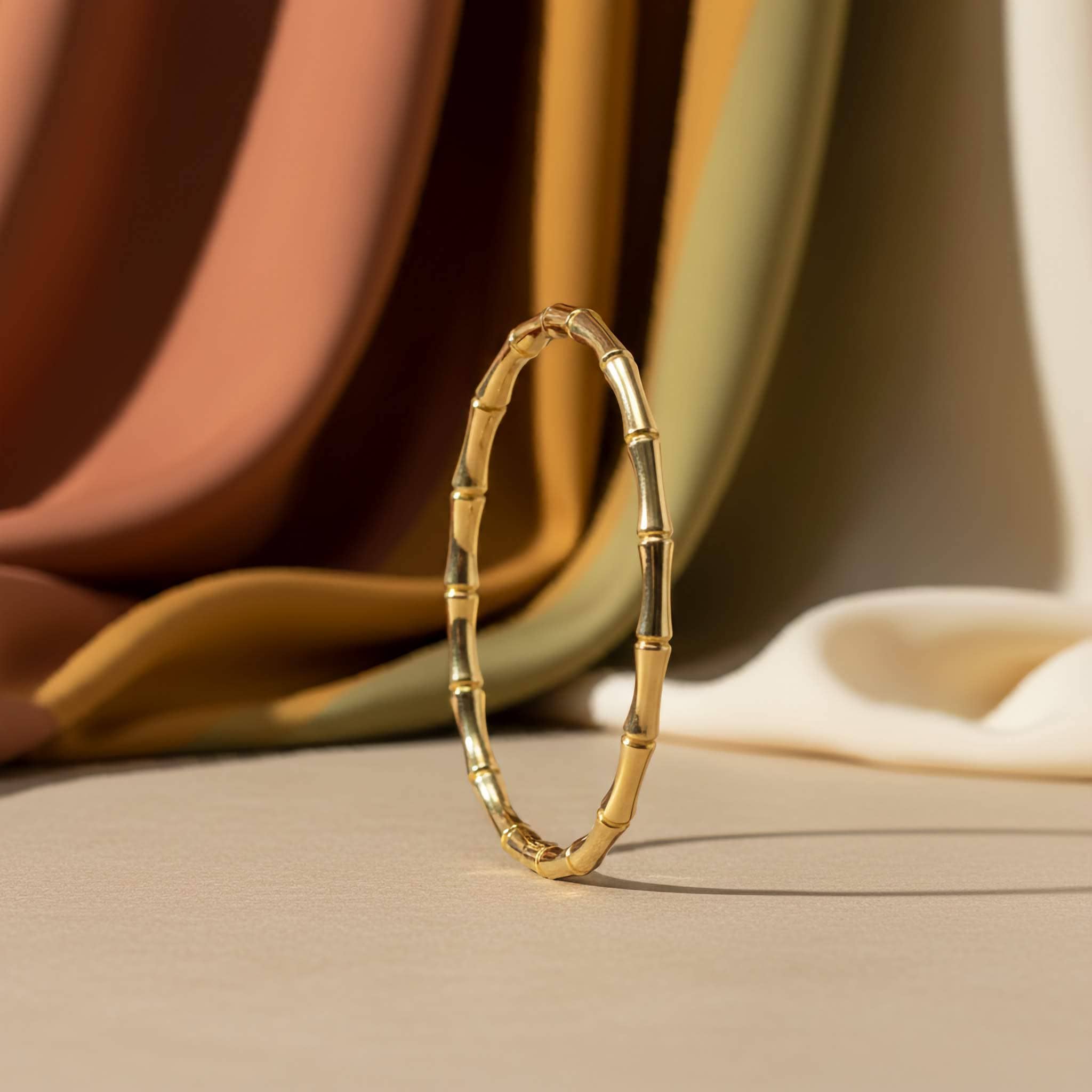 18k gold plated Bamboo-inspired bracelet on a neutral background