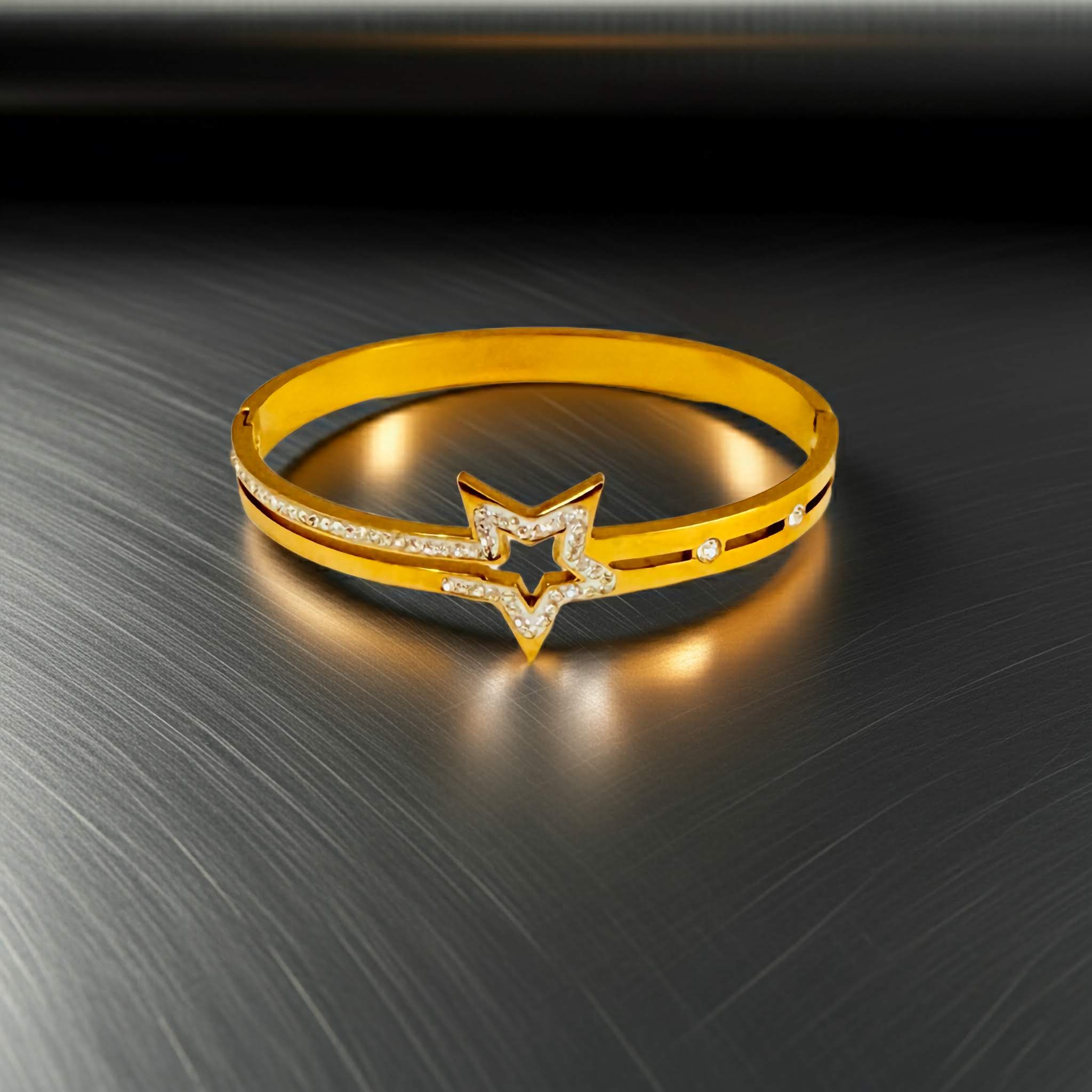 18k Gold bracelet with star design on a reflective surface