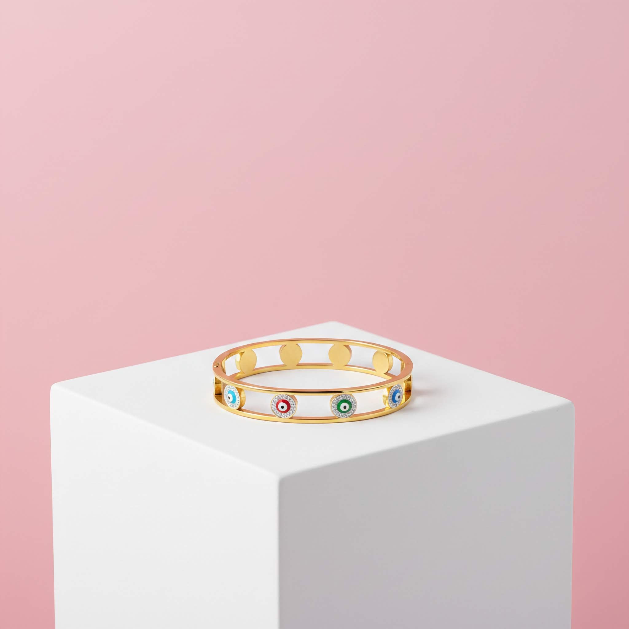 18k gold plated multicoloured evil eye bracelet in pink background