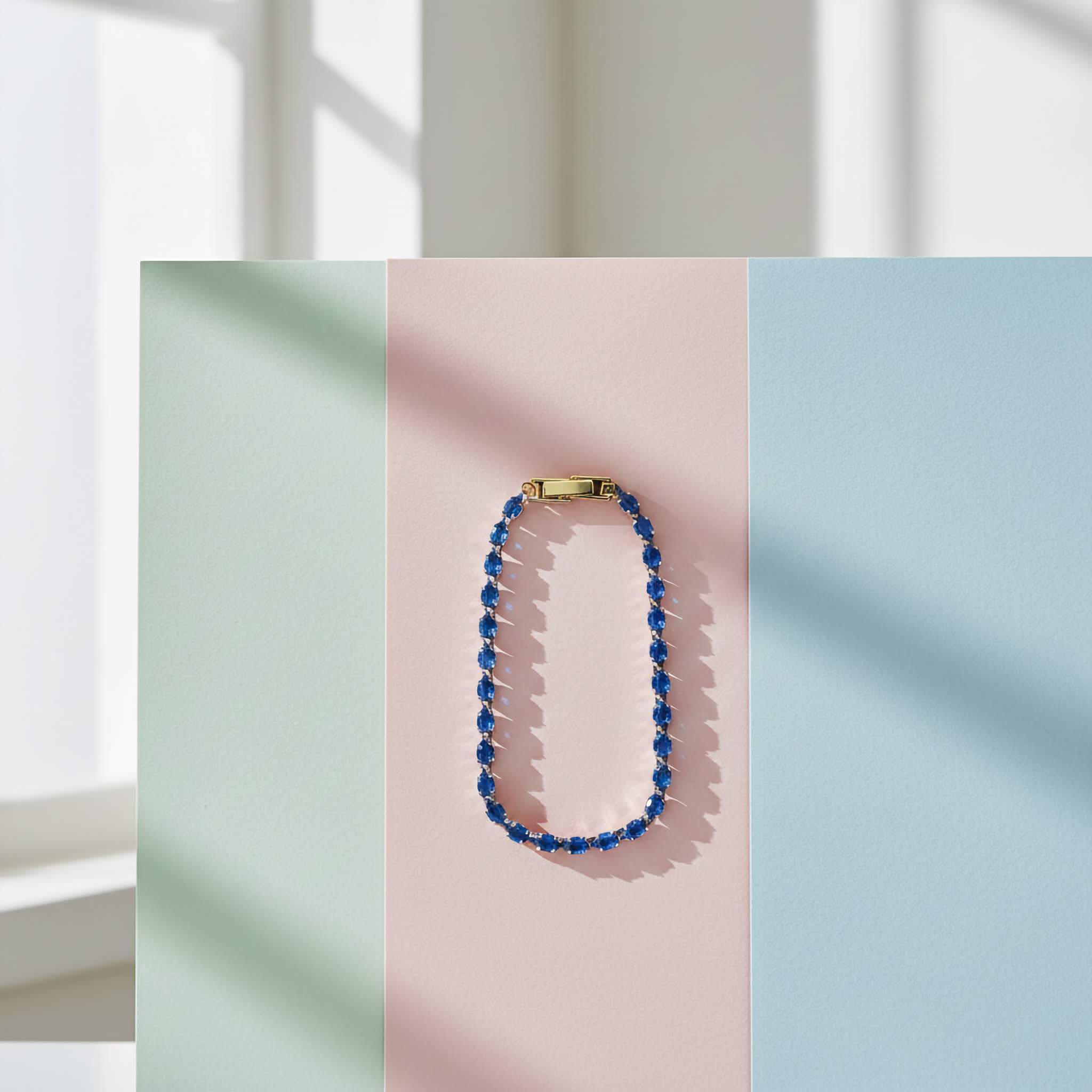 Luxury Statement Jewelry Bracelets collection Blue beaded necklace on a pastel background
