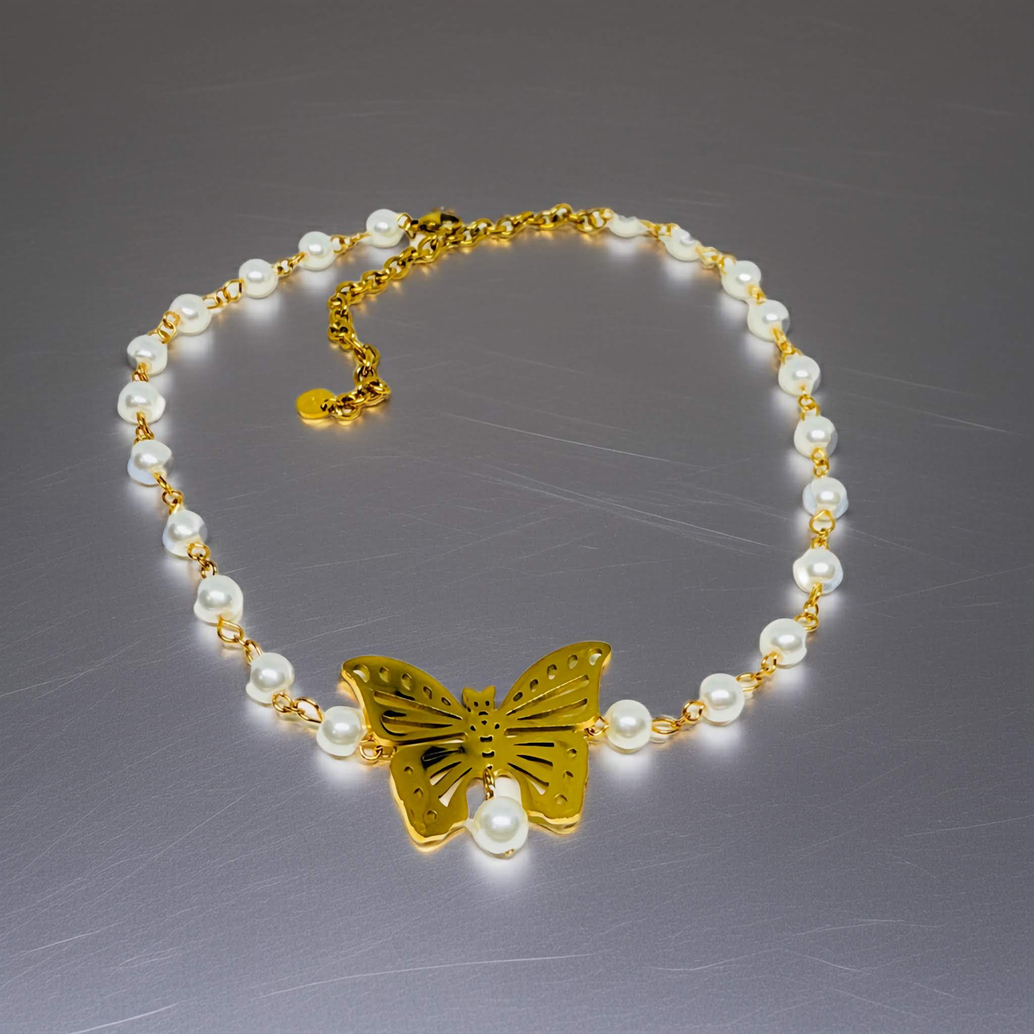 Pearl necklace with a gold butterfly pendant on a gray background
