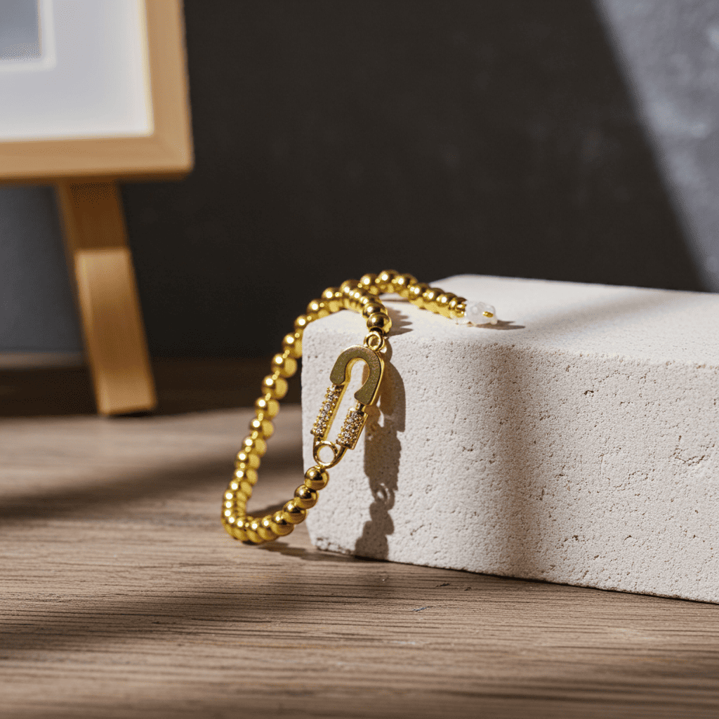shop beautiful slip-on Gold bracelet on a white stone surface with a dark background