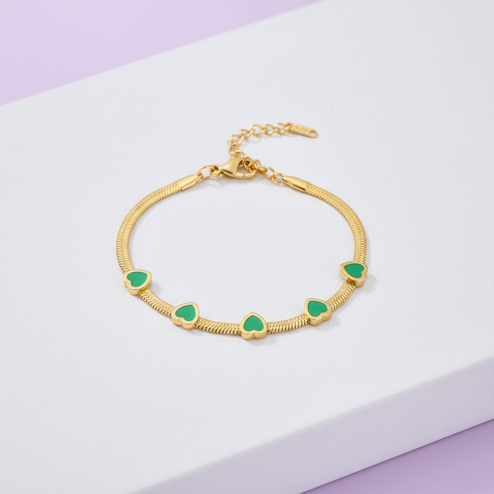 Elegant Green Crystal Bracelet heart-shaped stones on a light purple background