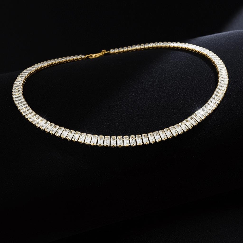 Gold tennis necklace with clear stones on a black background