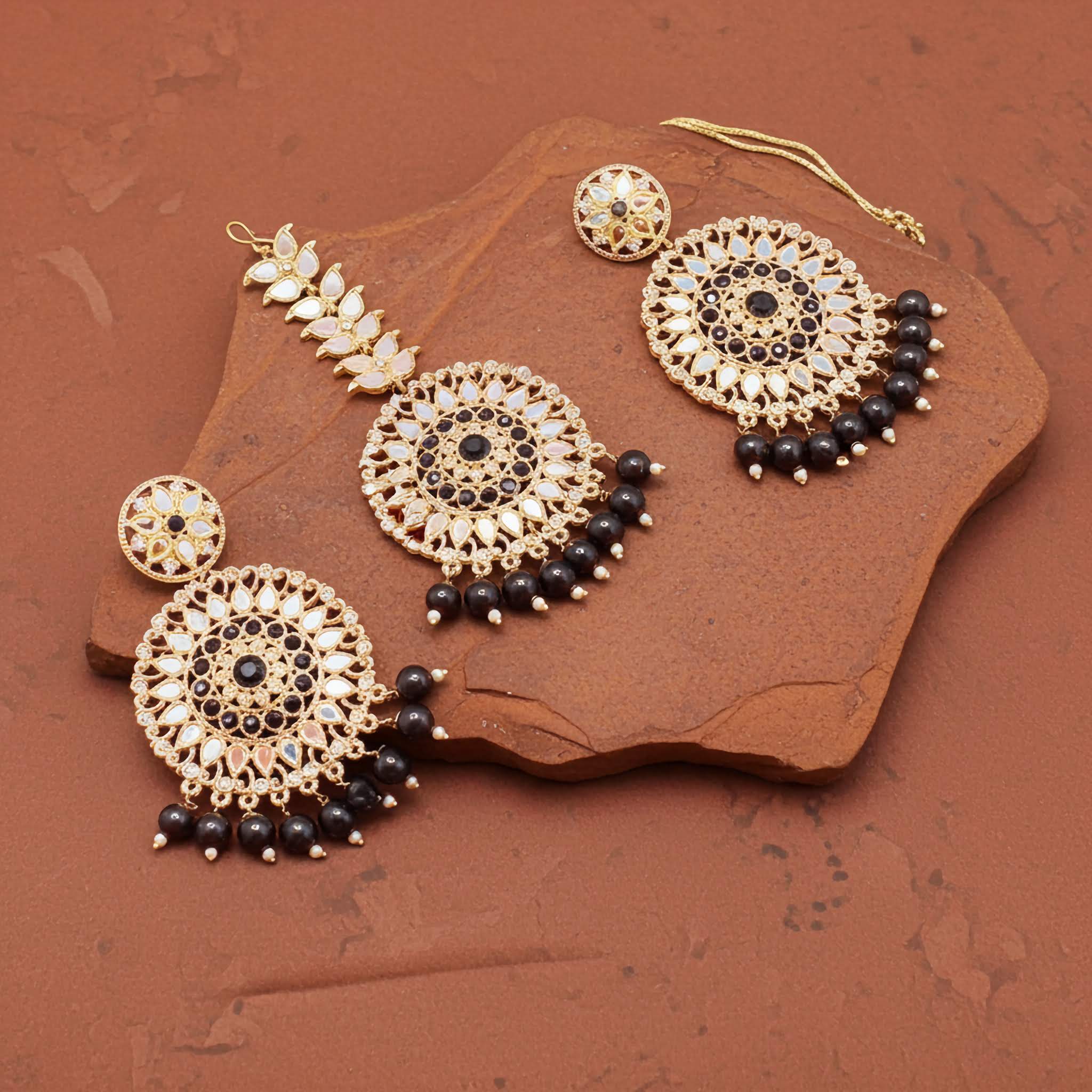 Mirror work earrings and tikka with black pearl brown stone surface