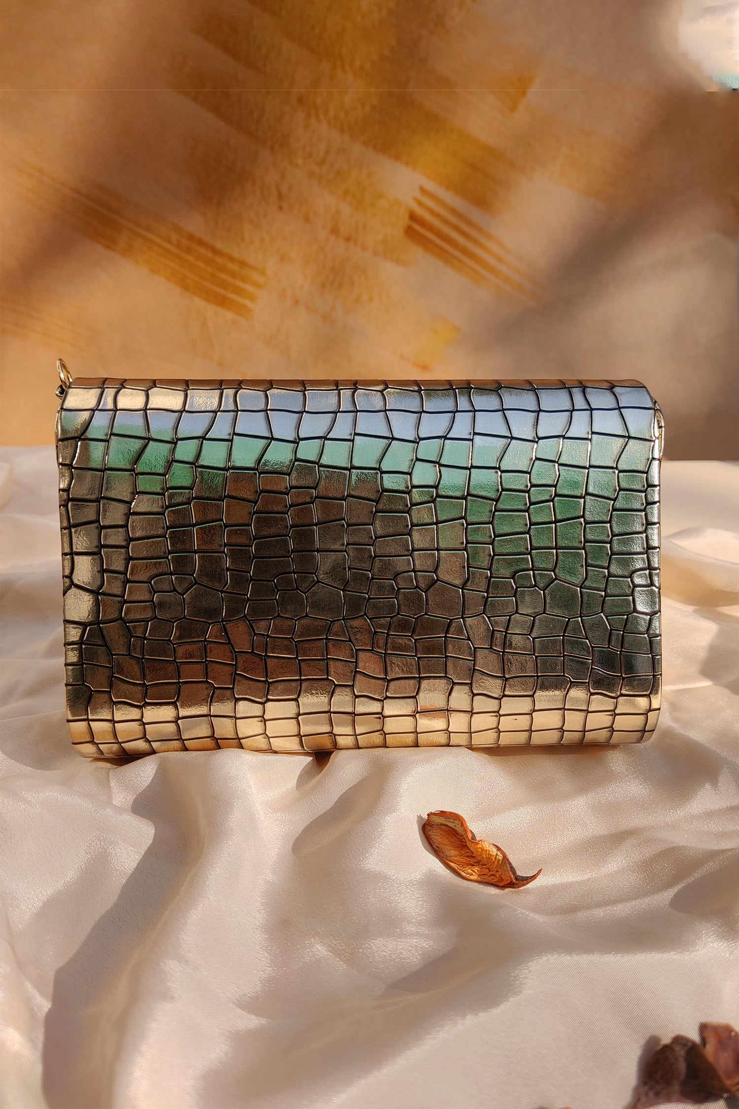 NOORIE GOLD HANDHELD CLUTCH