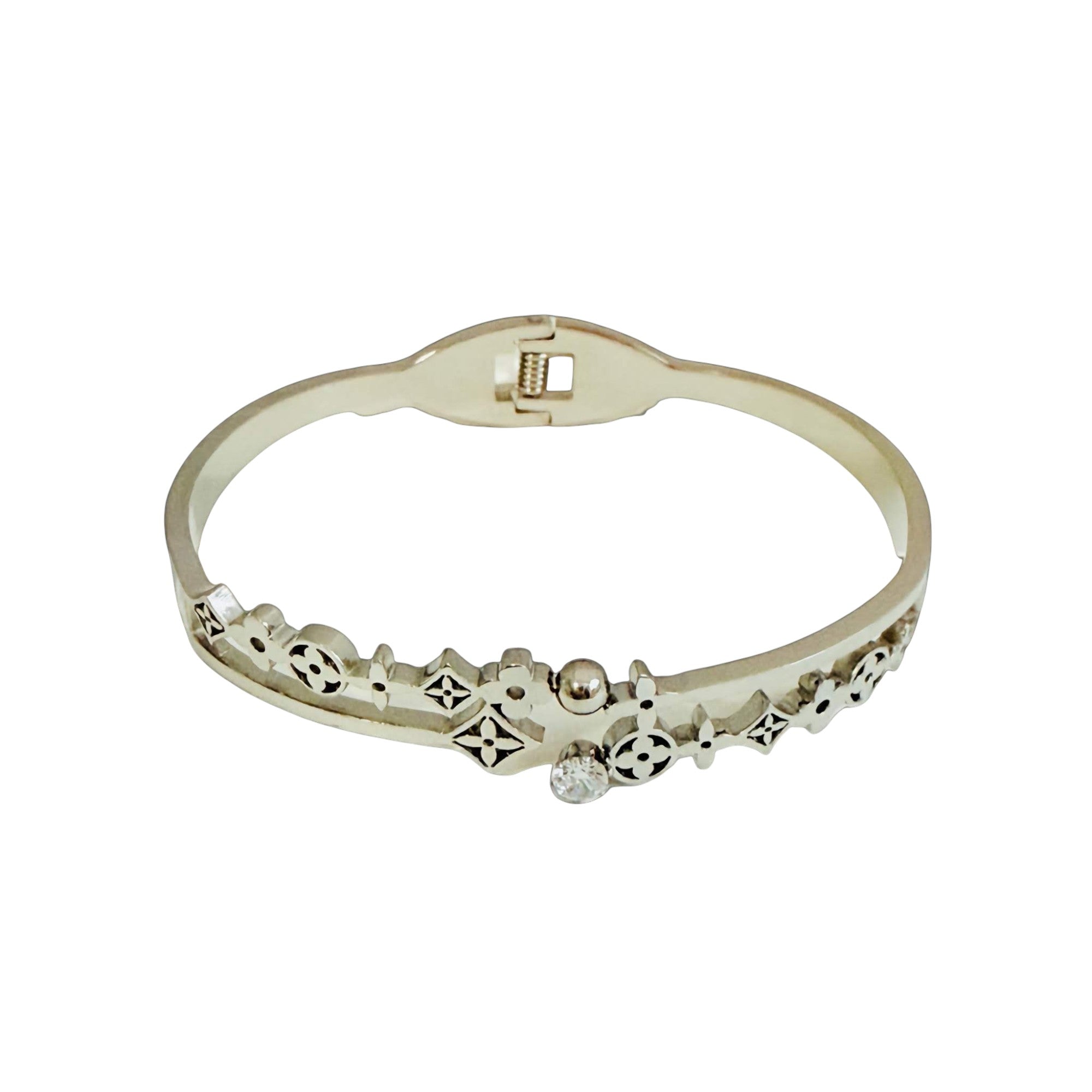 Silver bracelet with decorative elements on a white background