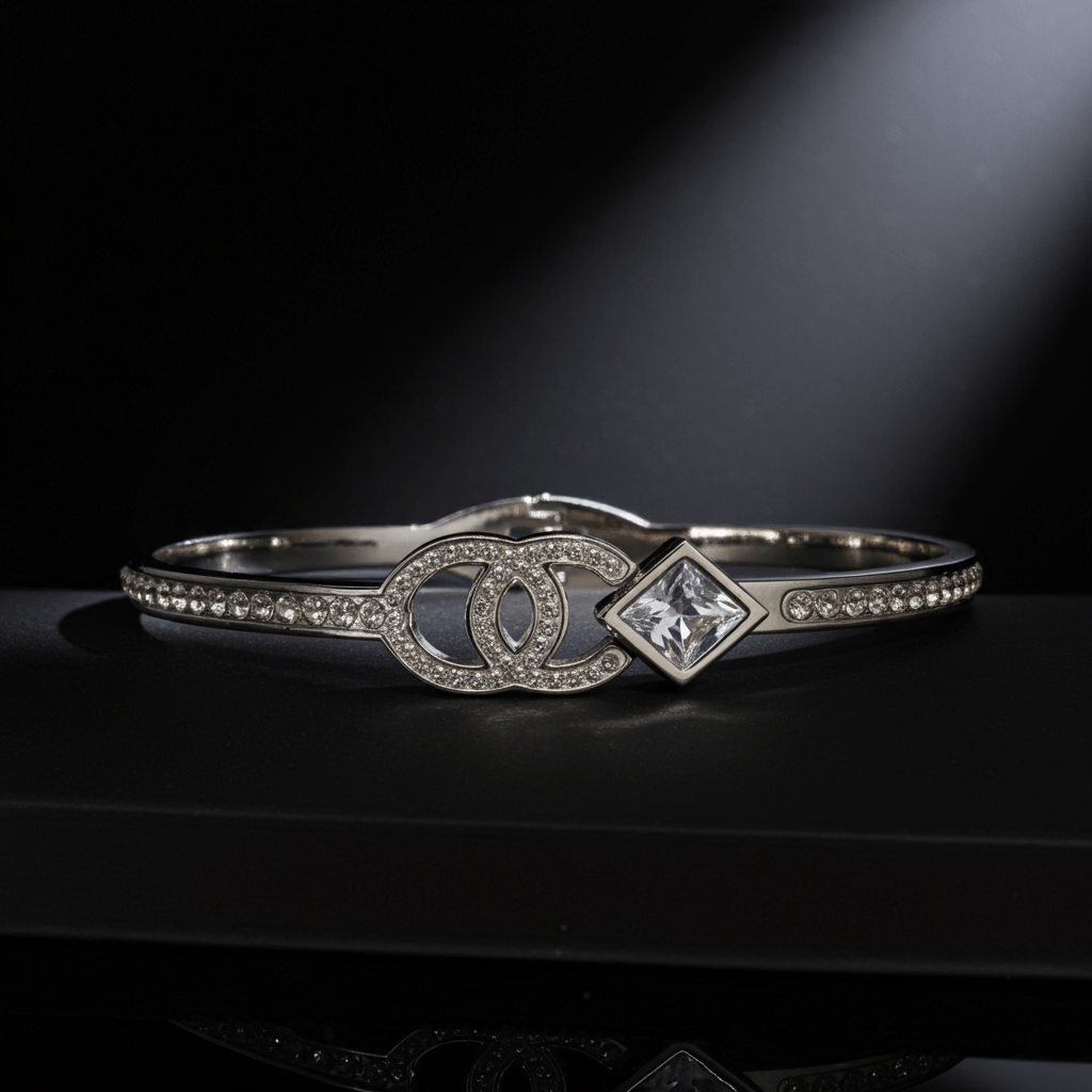 Silver bracelet with diamond accents on a dark background