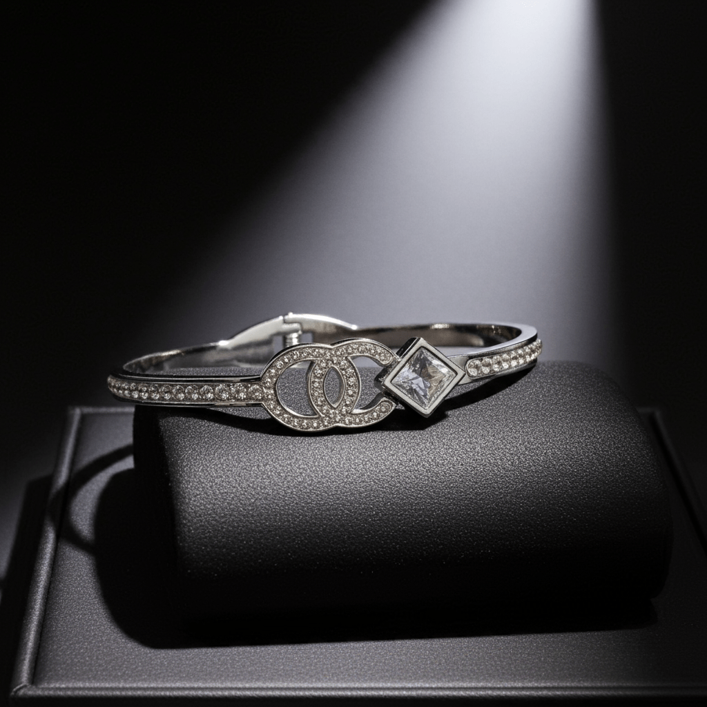 Silver bracelet with diamond accents on a dark surface