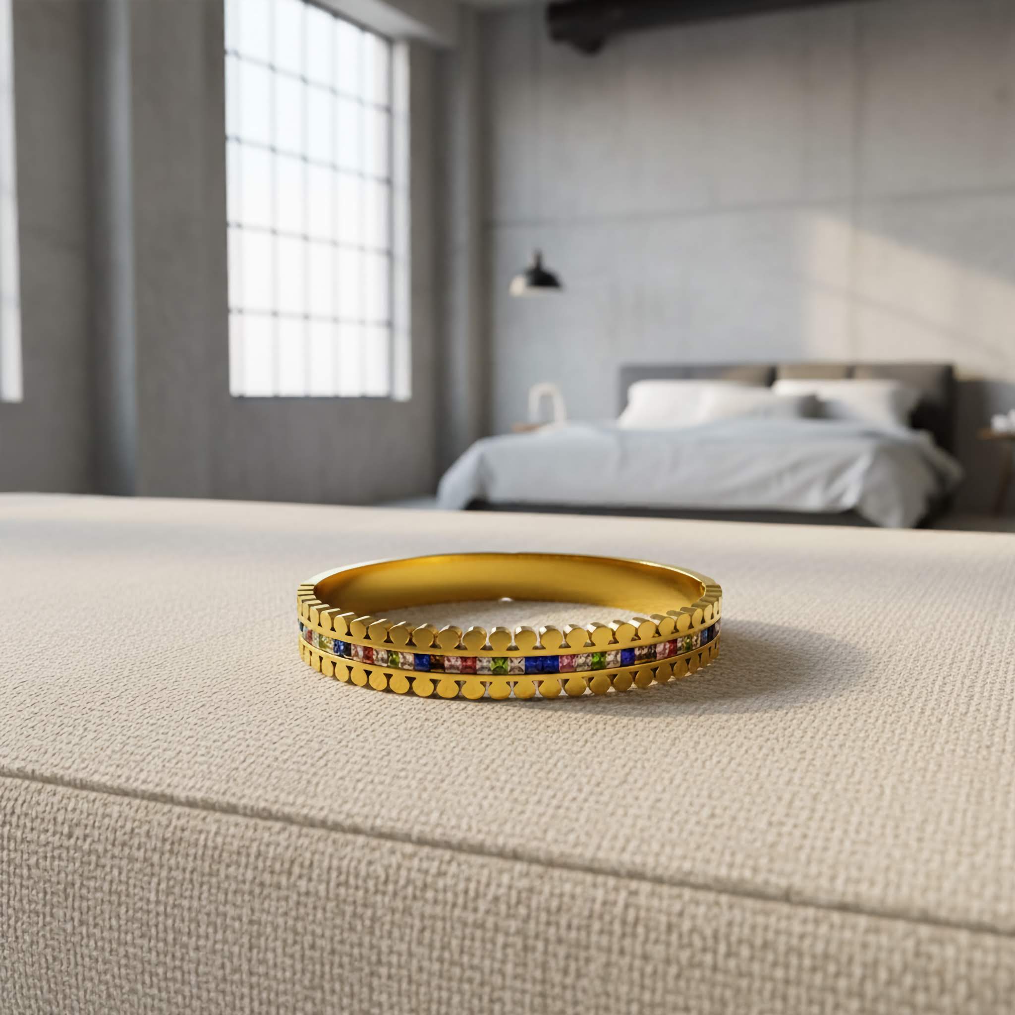 Waterproof Gold bracelet with colorful stones on a bed in a bedroom setting
