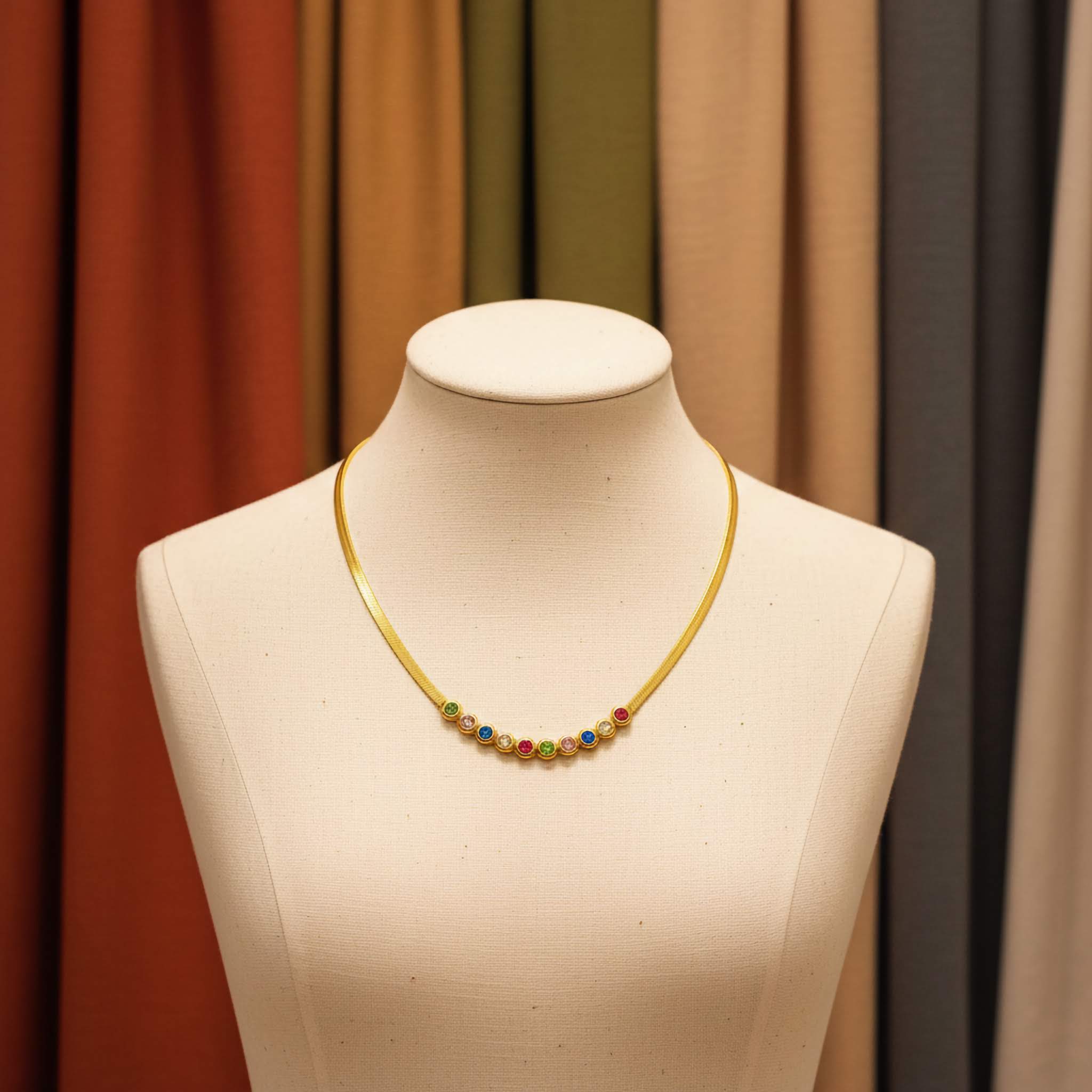 Mannequin wearing a colorful beaded necklace against a brown curtain background