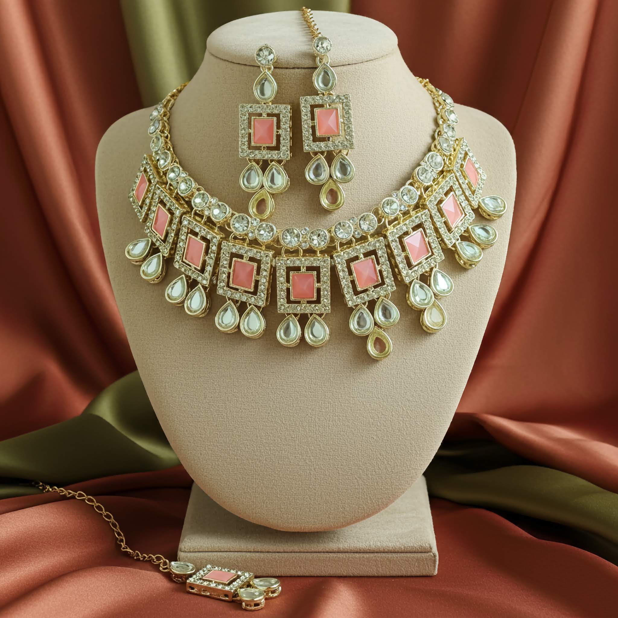 A Pink kundan silver choker set with earrings and tikka