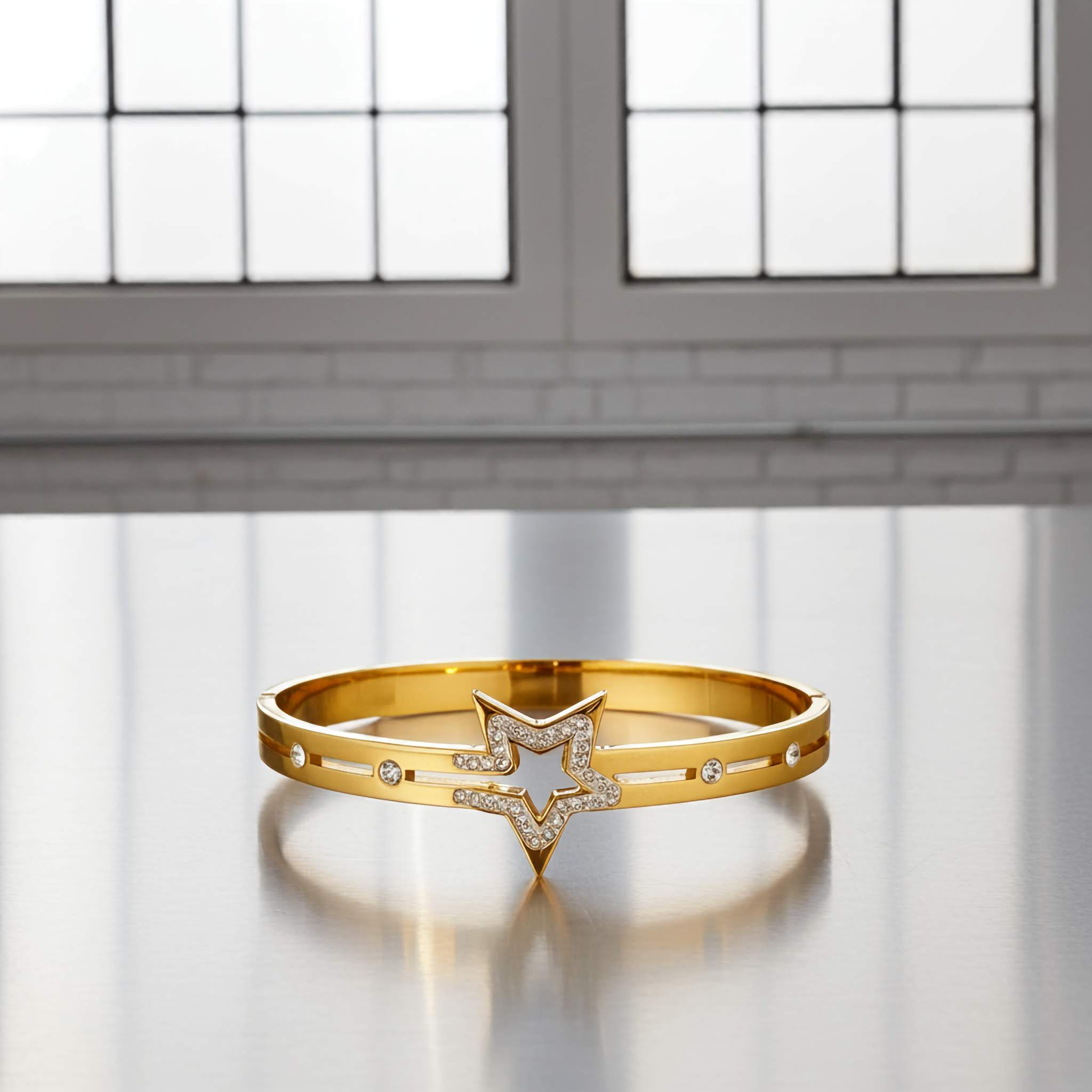 18k Gold bracelet with star design on a reflective surface
