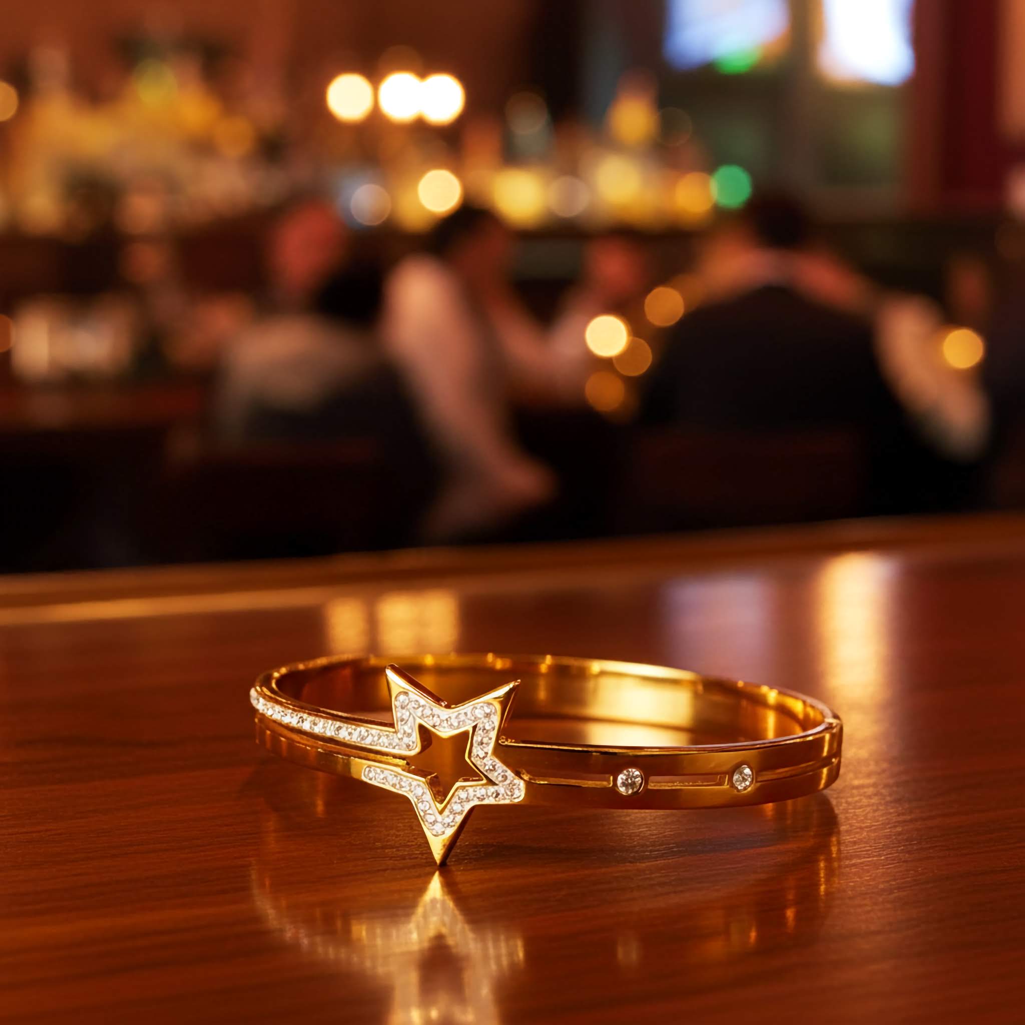18k Gold bracelet with white stones on a reflective surface in front of a fireplace