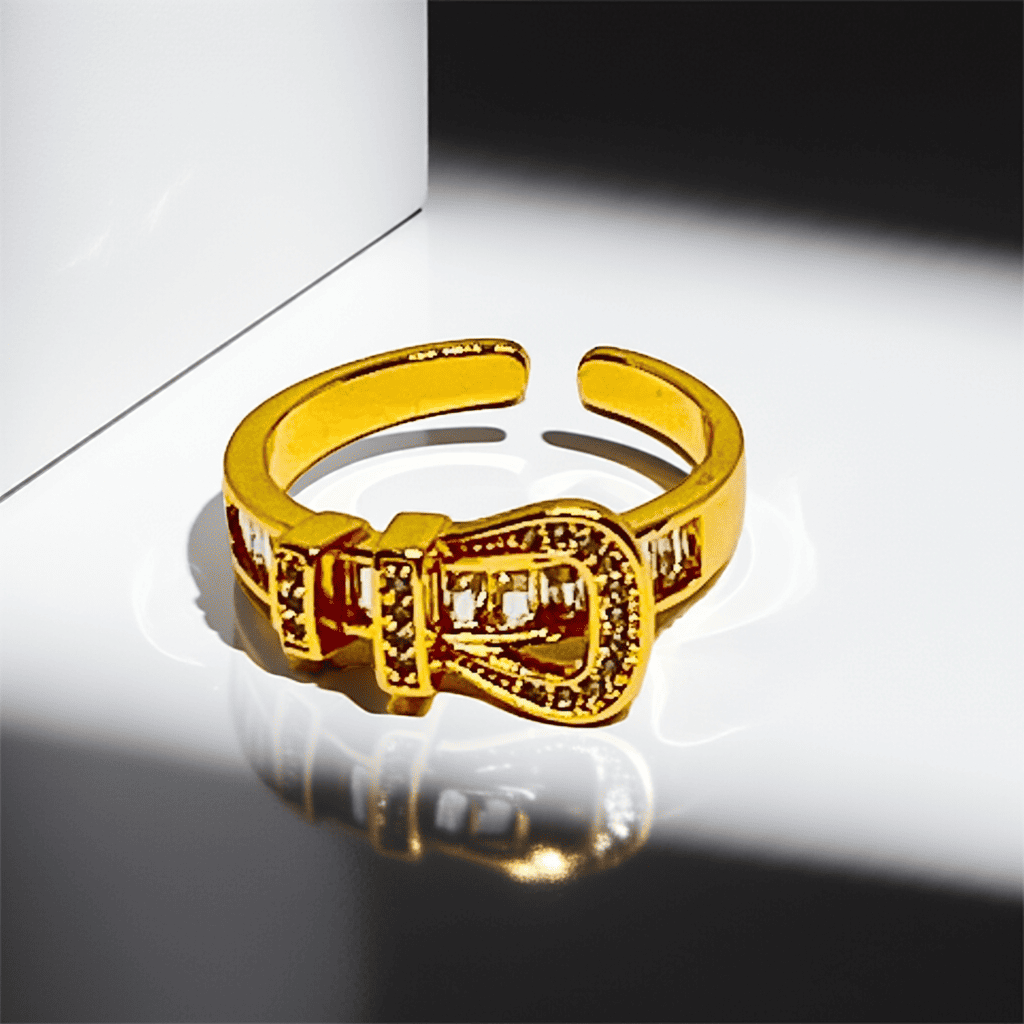 18k Gold ring with a unique design on a reflective surface