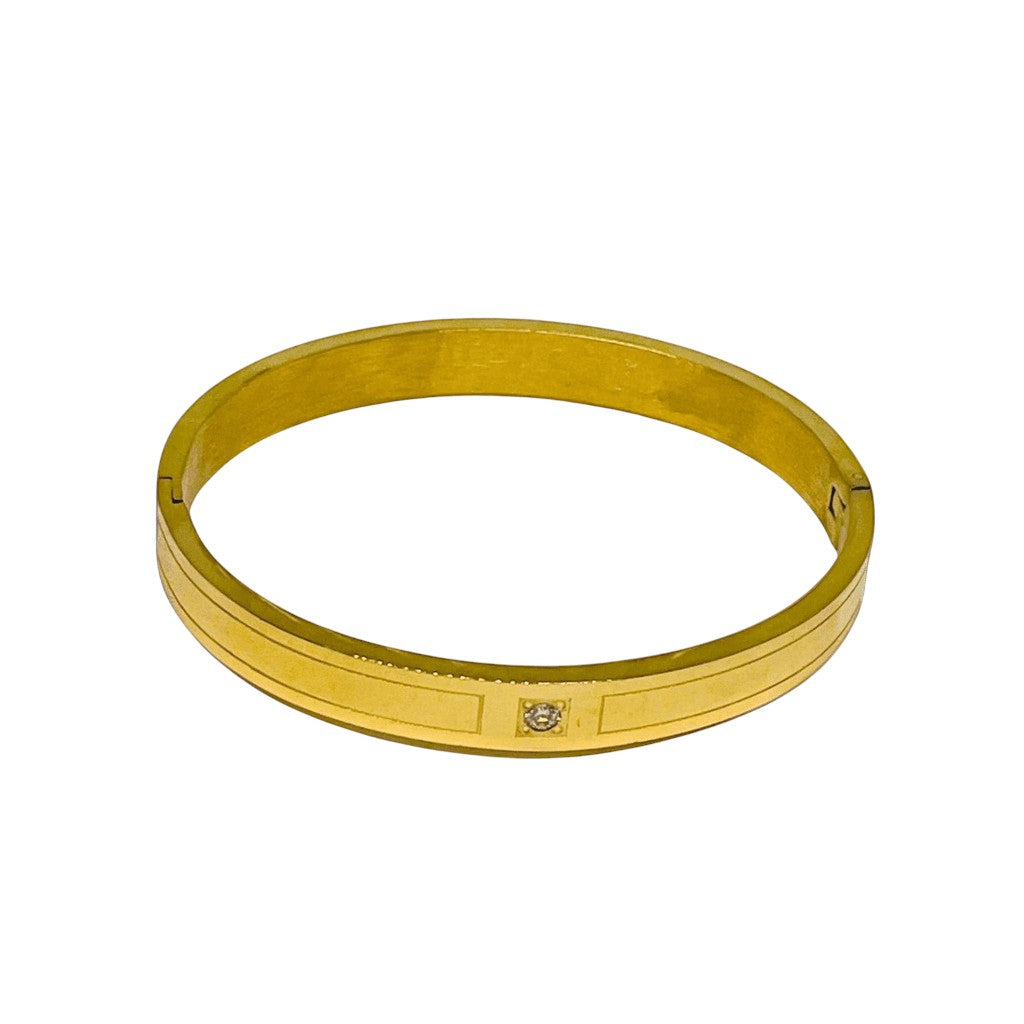 Gold bracelet on a white background