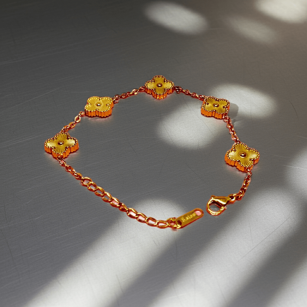 Bracelet with floral ends on a reflective surface