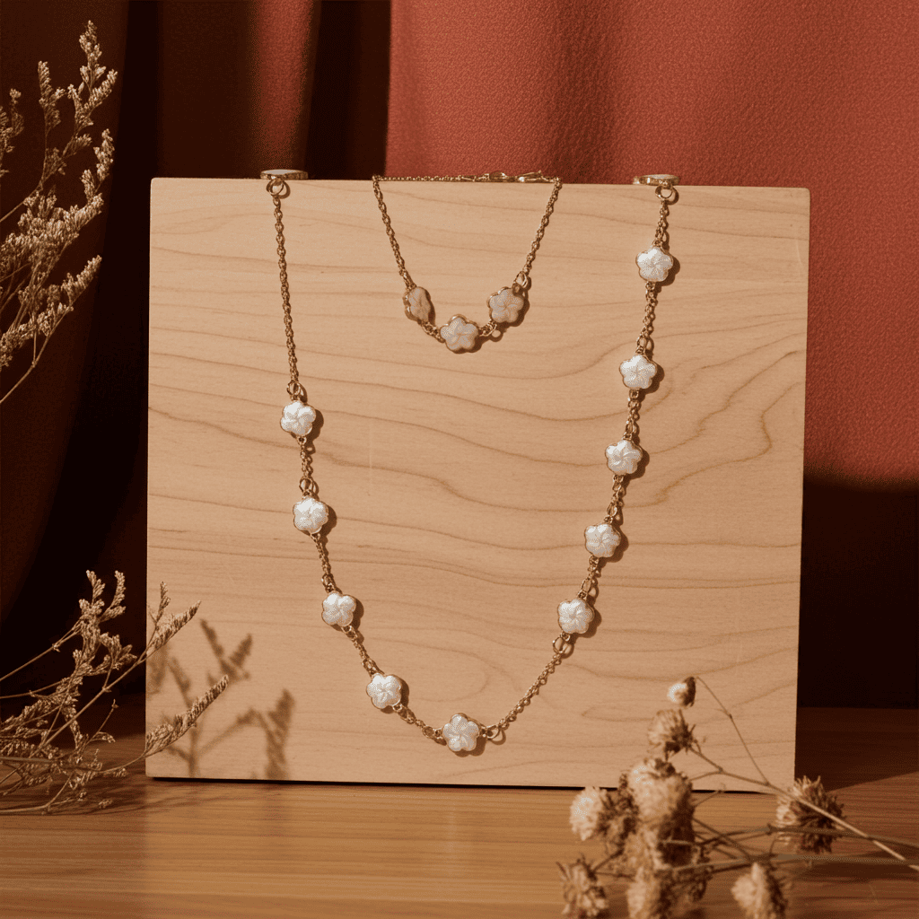 18k gold white clover necklace and bracelet on a wooden stand with a warm brown background