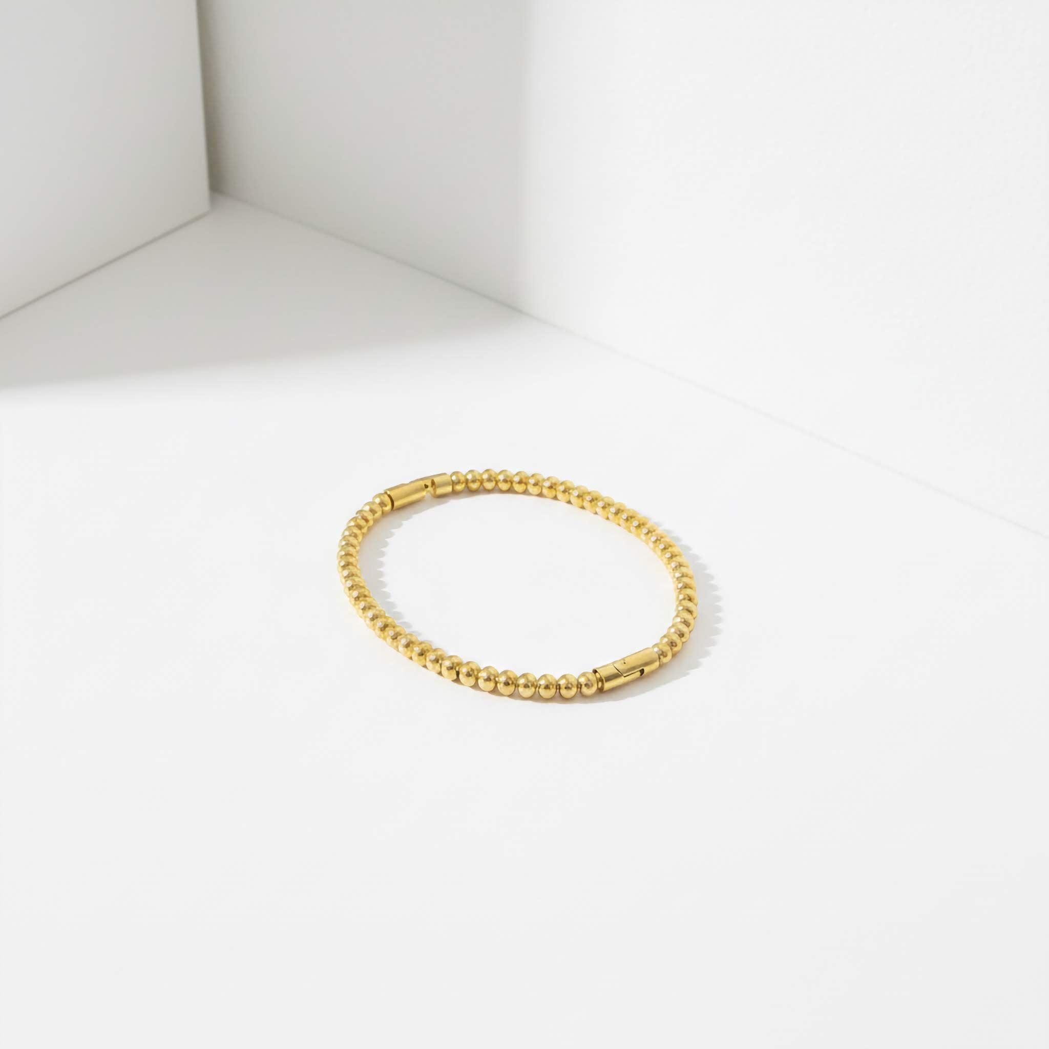 18k Gold bracelet bamboo inspired on a white background