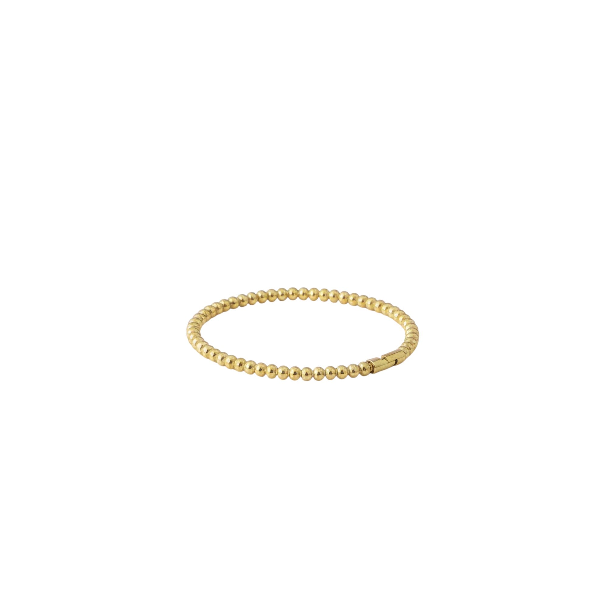 Gold beaded bracelet on a white background