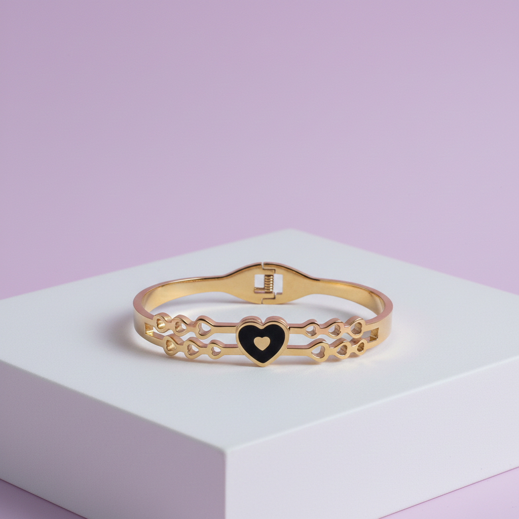 18k Gold bracelet with a heart-shaped charm on a light purple background