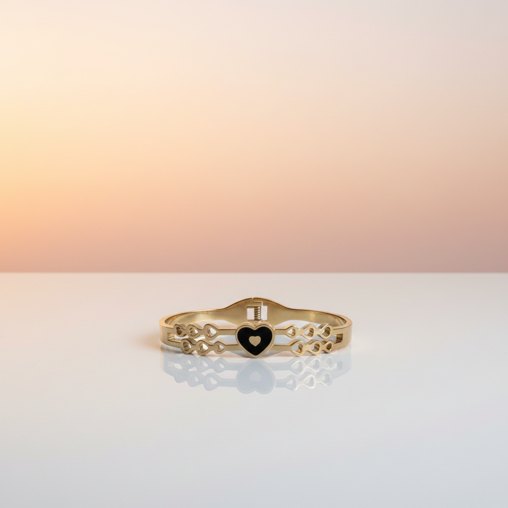 18k Gold plated bracelet with a heart charm on a gradient background