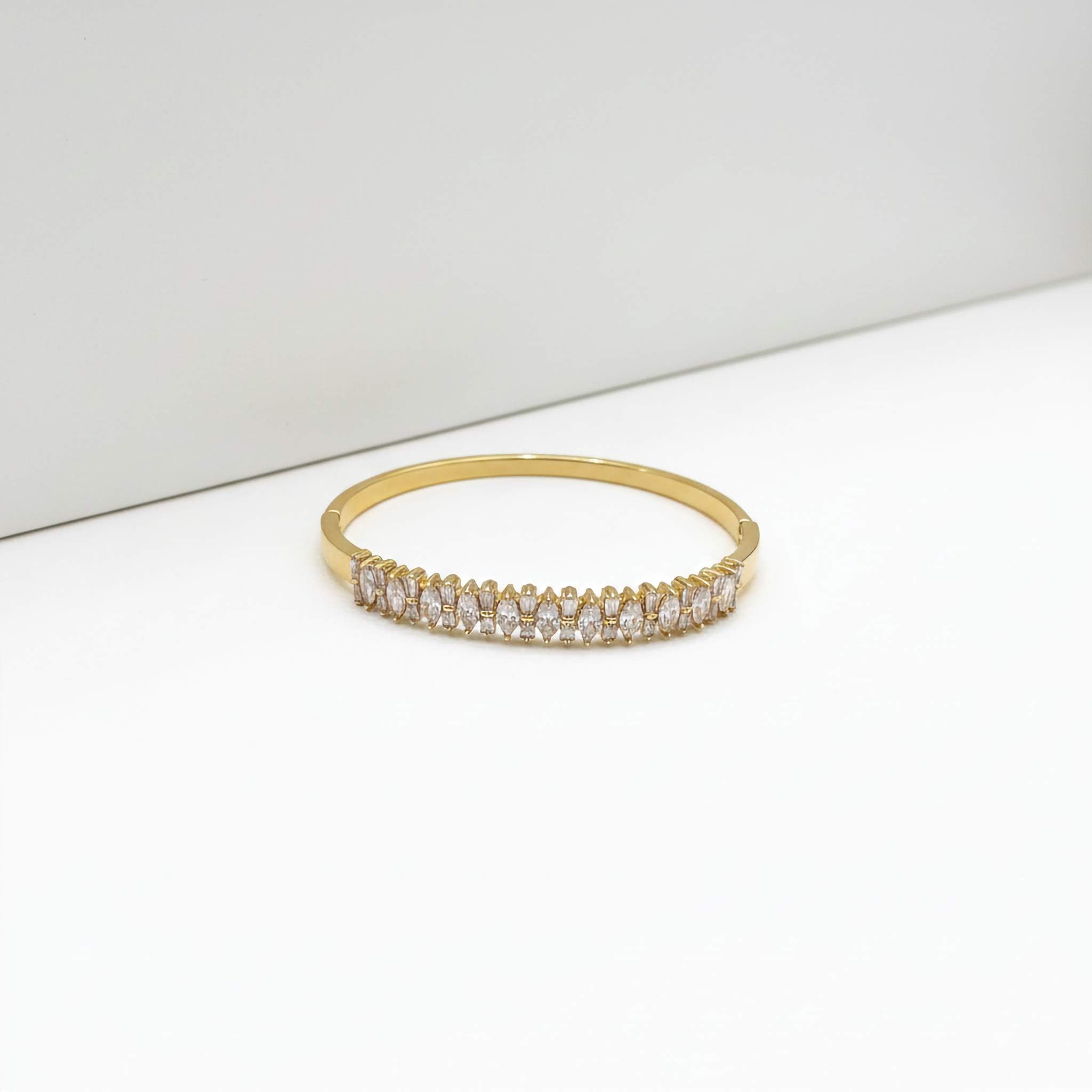 18k Gold plated bracelet with clear stones on a white surface