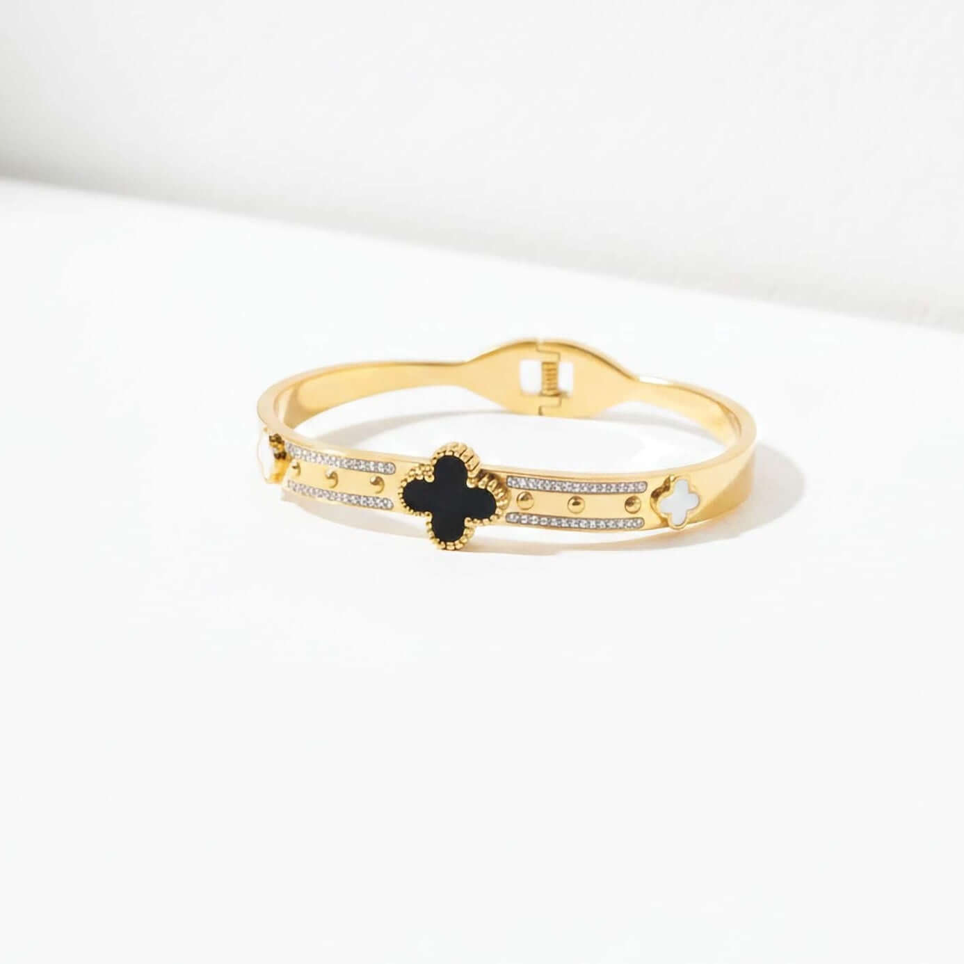 Black and white clover leaf bracelet on a white background