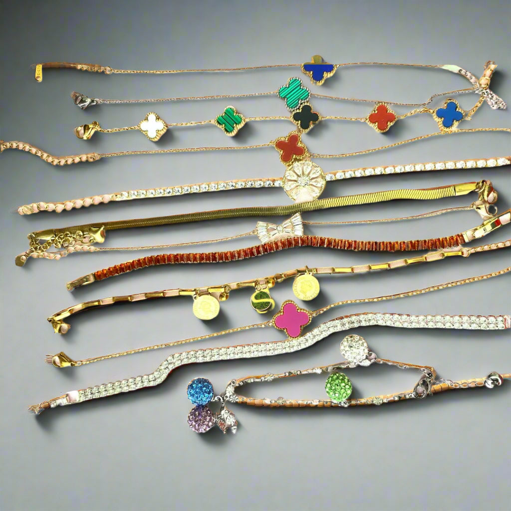 Collection of colorful bracelets on a light pink background