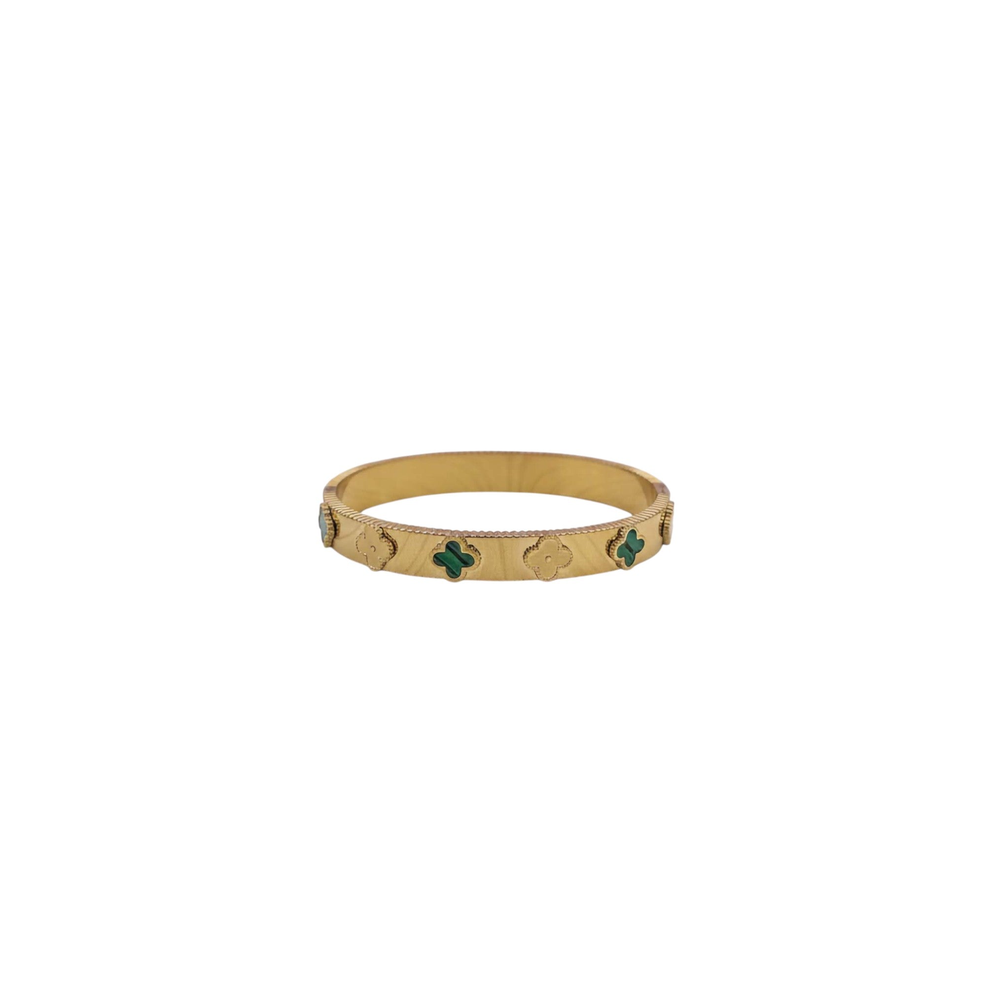 Gold bracelet with green stones on a white background