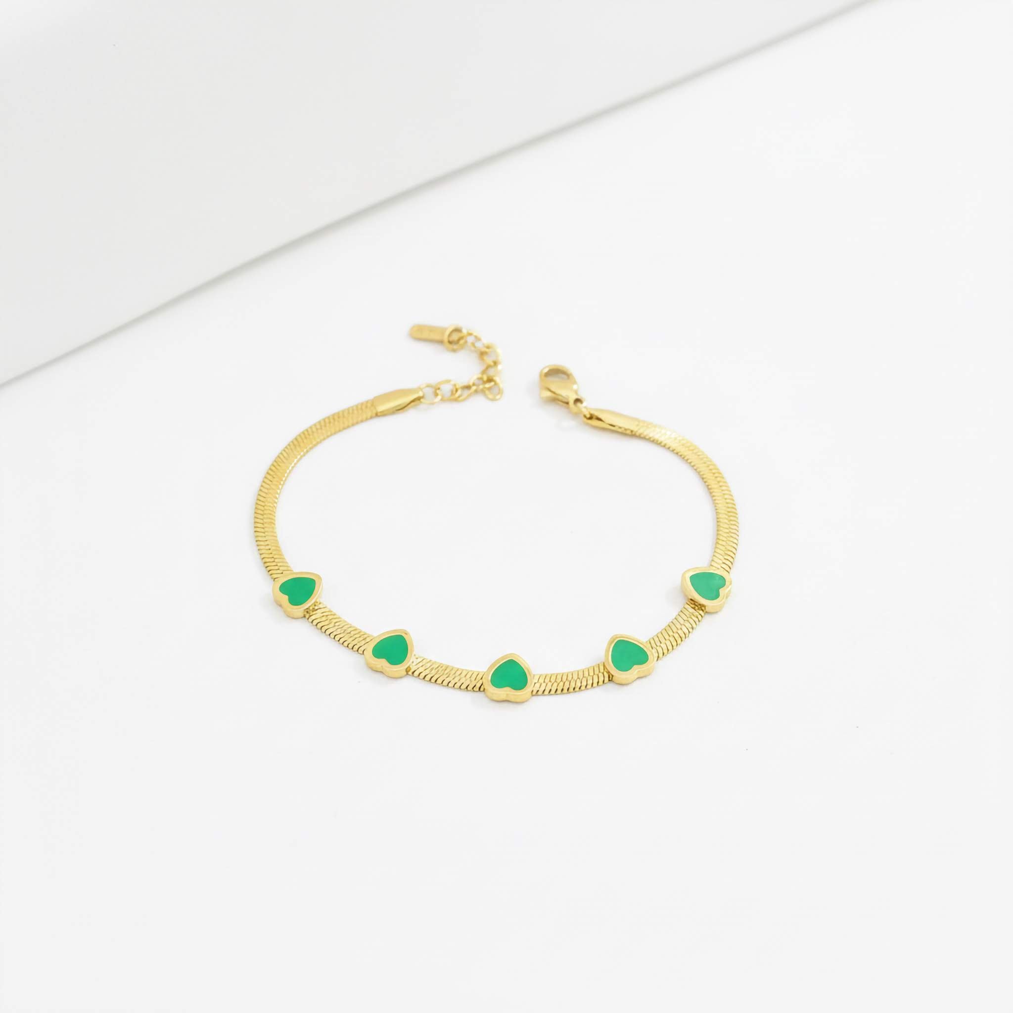 Elegant Green Crystal Bracelet green heart-shaped stones on a white background
