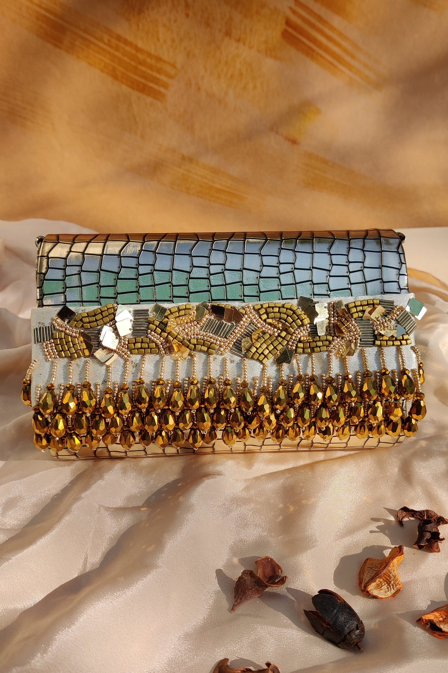 NOORIE GOLD HANDHELD CLUTCH