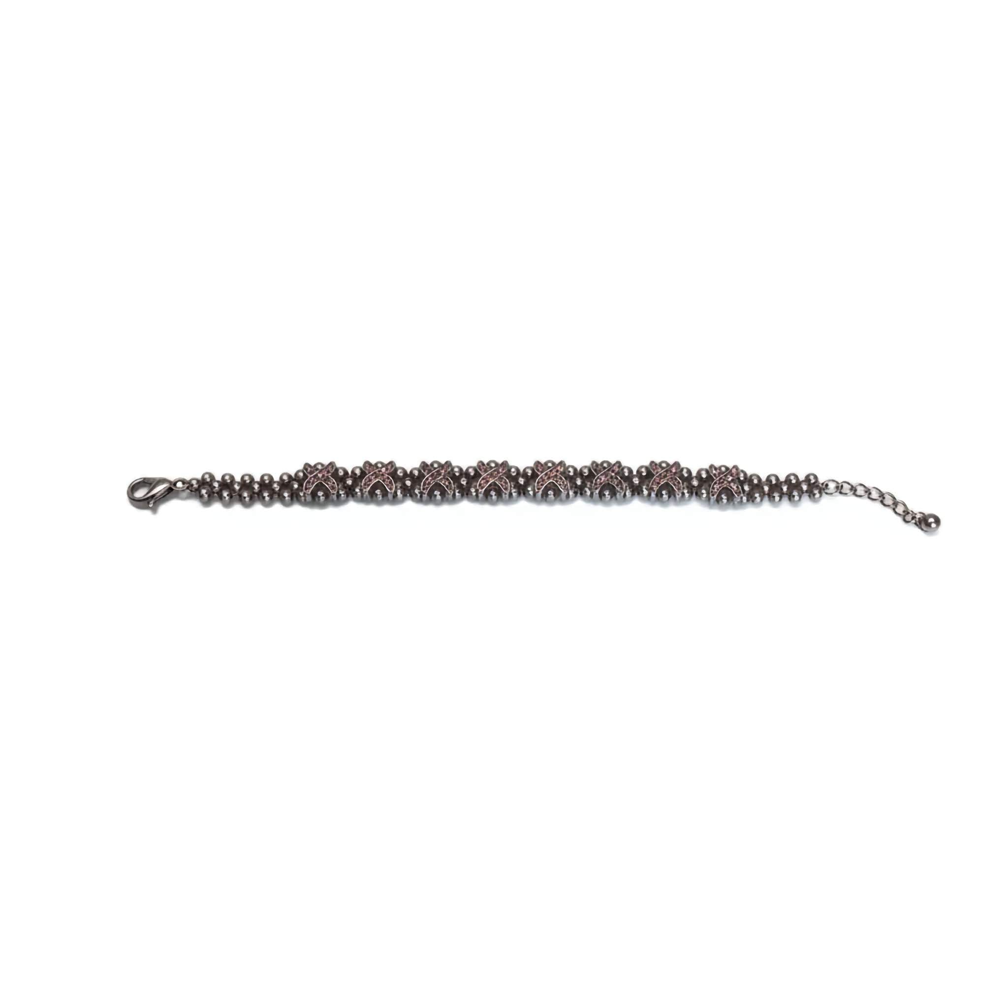 Oxidized bracelet with pink gemstones on a white background