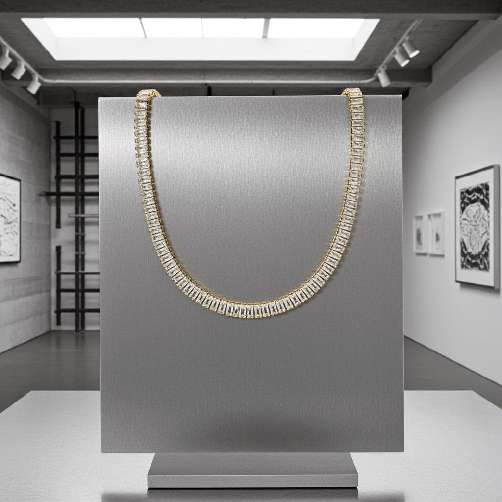 Gold necklace on a gray stand in a modern art gallery setting