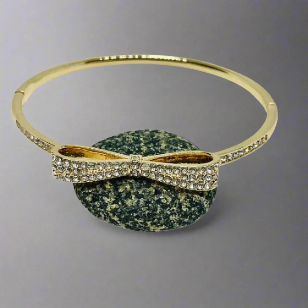 Shop bow design 14k golden plated bangle
