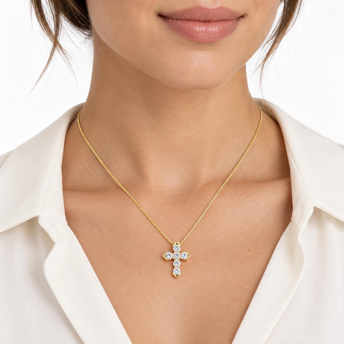 Model wearing LeDeSaRa 18K gold-plated AD stone cross pendant necklace with an ivory blouse