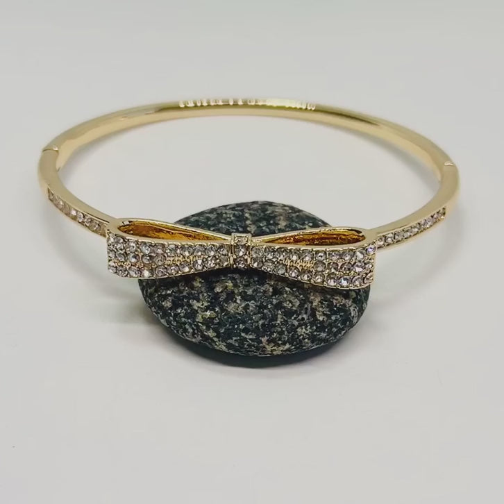 Shop bow design 14k golden plated bangle video