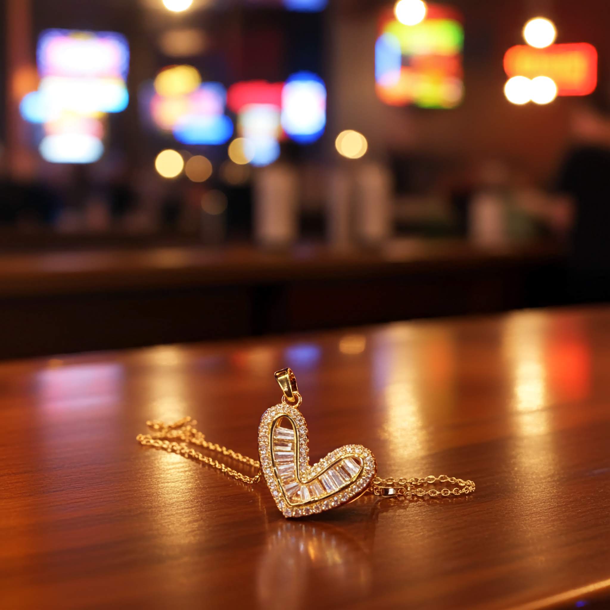 A swarovski crystal Heart-shaped necklace pendant on a wooden surface with a blurred bar background